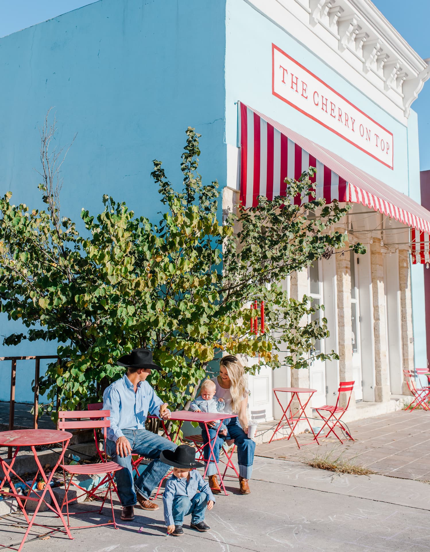 A family outside The Cherry on Top in downtown Lampasas, Texas